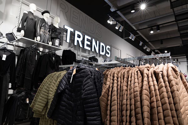 An image of indoor signage for a clothing store.